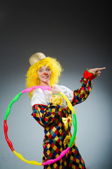 Clown in funny concept on dark background