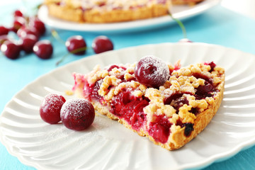 Tasty homemade pie with cherries on table close up