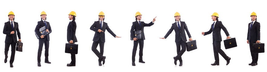 Young architect wearing hardhat on white