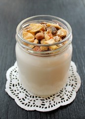 
Natural fresh homemade yogurt from cow's milk handmade with probiotic bacteria, with muesli sunflower seeds, candied fruits, dried fruits, nuts