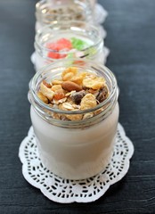 
Natural fresh homemade yogurt from cow's milk handmade with probiotic bacteria, with muesli sunflower seeds, candied fruits, dried fruits, nuts