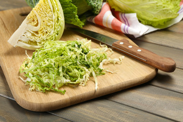 Cut savoy cabbage on wooden cutting board