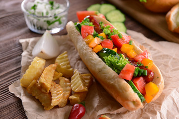 Hot dogs and vegetables on craft paper closeup