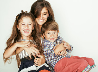 young mother with two children on white, happy smiling family inside