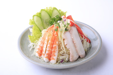 Mixed Seafoodi salad in white dish isolated on white background