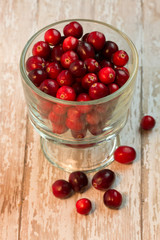 Bowl of Cranberries on a wooden background