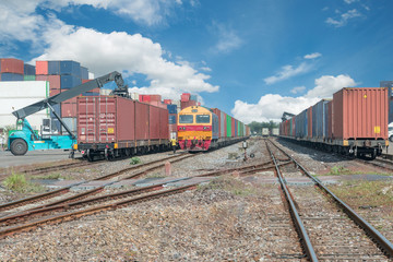 Obraz premium Cargo train platform with freight train container at depot