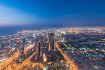 Naklejka na ściany i meble Panorama of night Dubai during sunset