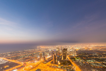Panorama of night Dubai during sunset