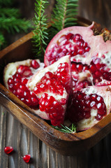 Sweet fresh pomegranate on the vintage table