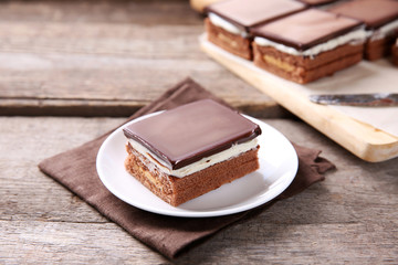 Delicious chocolate brownies on wooden background