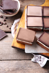 Delicious chocolate brownies on wooden background