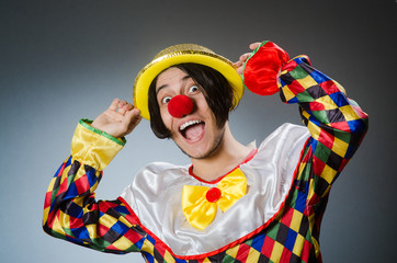 Funny clown against dark background