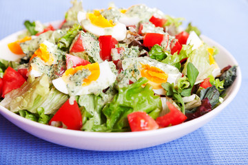 Summer salad with tomatos and boiled eggs