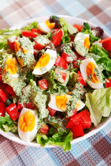 Summer salad with tomatos and boiled eggs