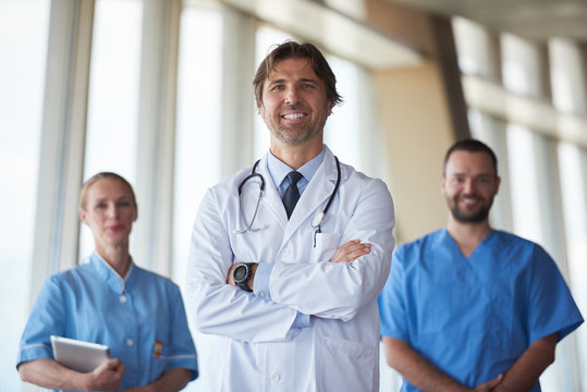group of medical staff at hospital, handsome doctor in front of