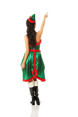 Back view of woman wearing elf clothes pointing up