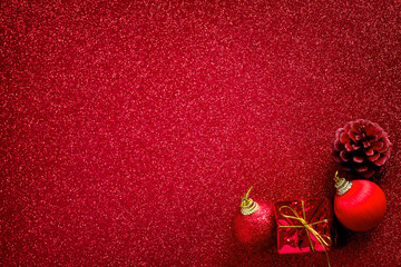 red christmas ball and gift decoration glitter background