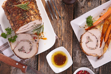 roast meat rolled up with ham and herb