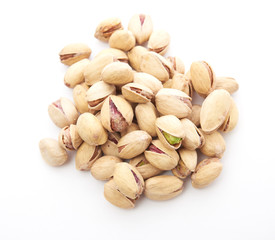 Heap of pistachios nuts isolated on the white