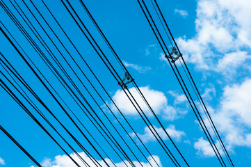 High voltage transmission lines on blue sky