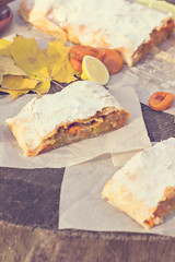 Strudel with custard and orange. Christmas Stollen. Christmas table decoration.