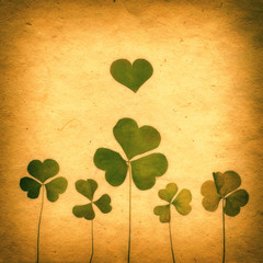 Sepia Vintage card with Leaf clover and Old Paper Texture.