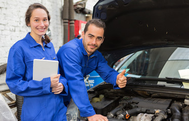 Team of mechanics working at the garage