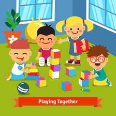 Kids playing together in kindergarten room