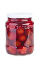Glass jar with preserved plums