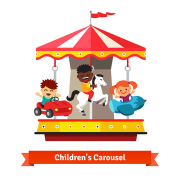 Kids having fun on a carnival carousel