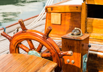 steering wheel and compass on a sailing boat © meanmachine77