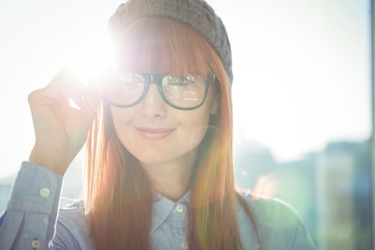 Portrait of smiling hipster woman posing