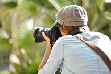 Portrait of cheerful young photographer