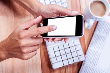 Businesswoman holding her smartphone