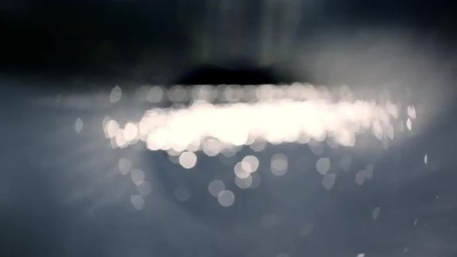 Mystic abstract shiny texture with glowing sparkles on dark blur background. Loopable. Full HD footage 1920x1080
