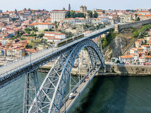 View of Dom Luis I Bridge, city walls and historic district Ribeira from Mosteiro da Serra do Pilar in Gaia, Porto, Portugal