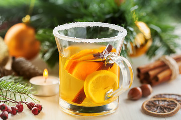 Christmas traditional hot drink. Mulled cider with fruits and cinnamon.