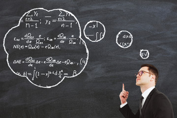 Businessman solves the equation and has idea concept