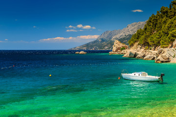 Beautiful bay and beach with motorboat,Brela,Dalmatia region,Croatia