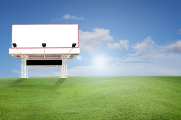 Blank billboard for your advertisement on field of grass 