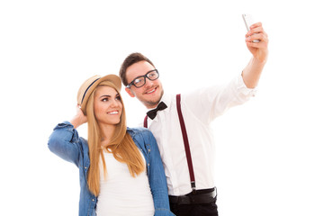Young hipster couple making a selfie