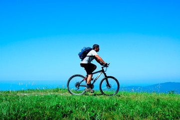 Fototapeta premium Cyclist rides a bicycle