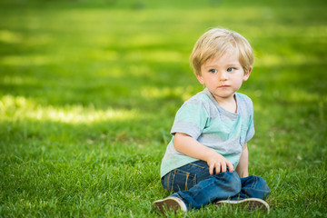 Blonde little boy at the park