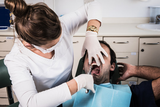 Dentist performing a complicated procedure