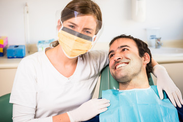 Female dentist and her happy patient