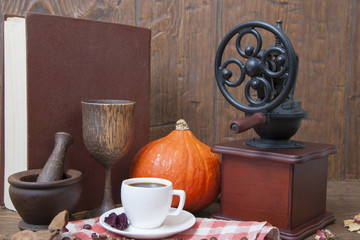 Fototapeta na wymiar White cup of coffee on the autumn background