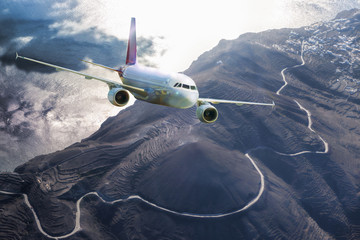 Airplane above Santorini island in Greece