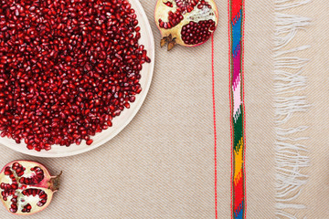 Full plate of peeled pomegranate seeds good for healthy and proper nutrition