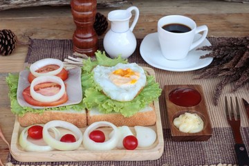 Slice bread ,ham ,fried eggs with breakfast.